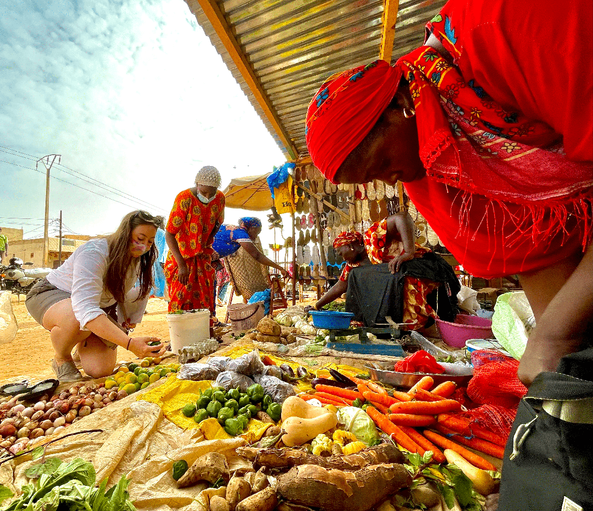 Kim Hoffman selectsing food from a local farmers market