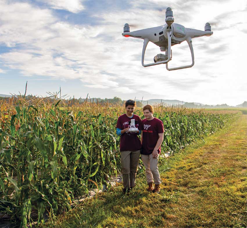 students flying a drone